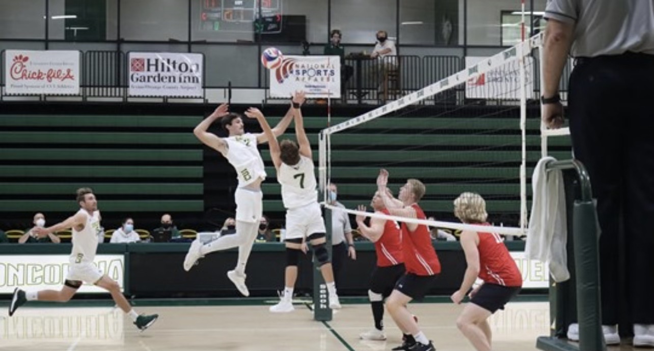 The men's volleyball team is in unison with sets, bumps, and spikes